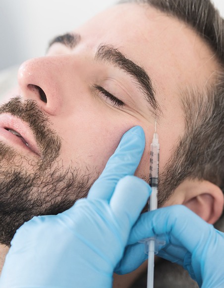 a man receiving a BOTOX injection